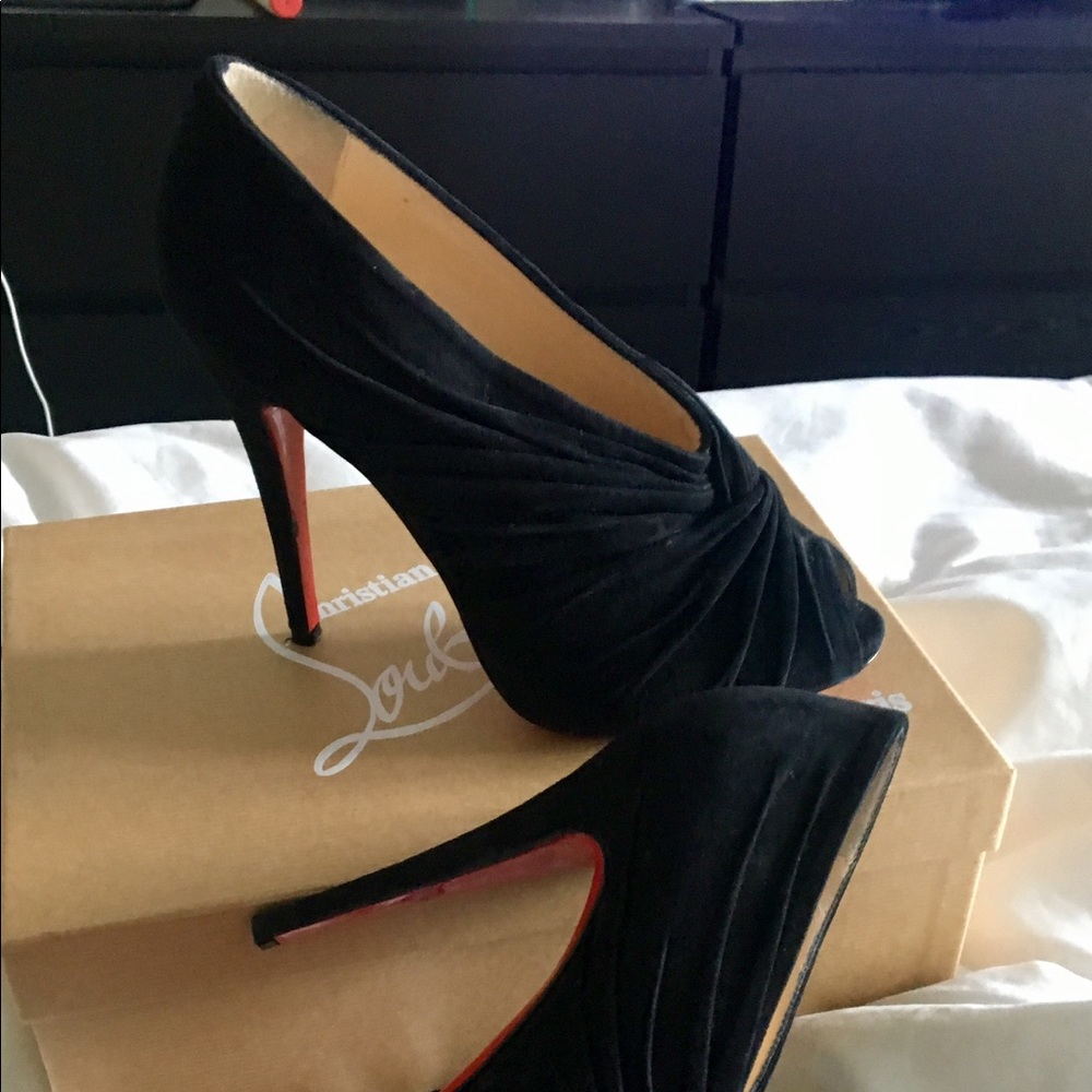Louboutin booties more of a sexy pump.   Worn 1x